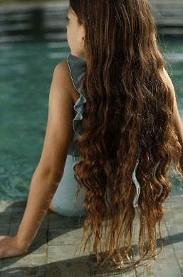 A girl relaxing in the pool