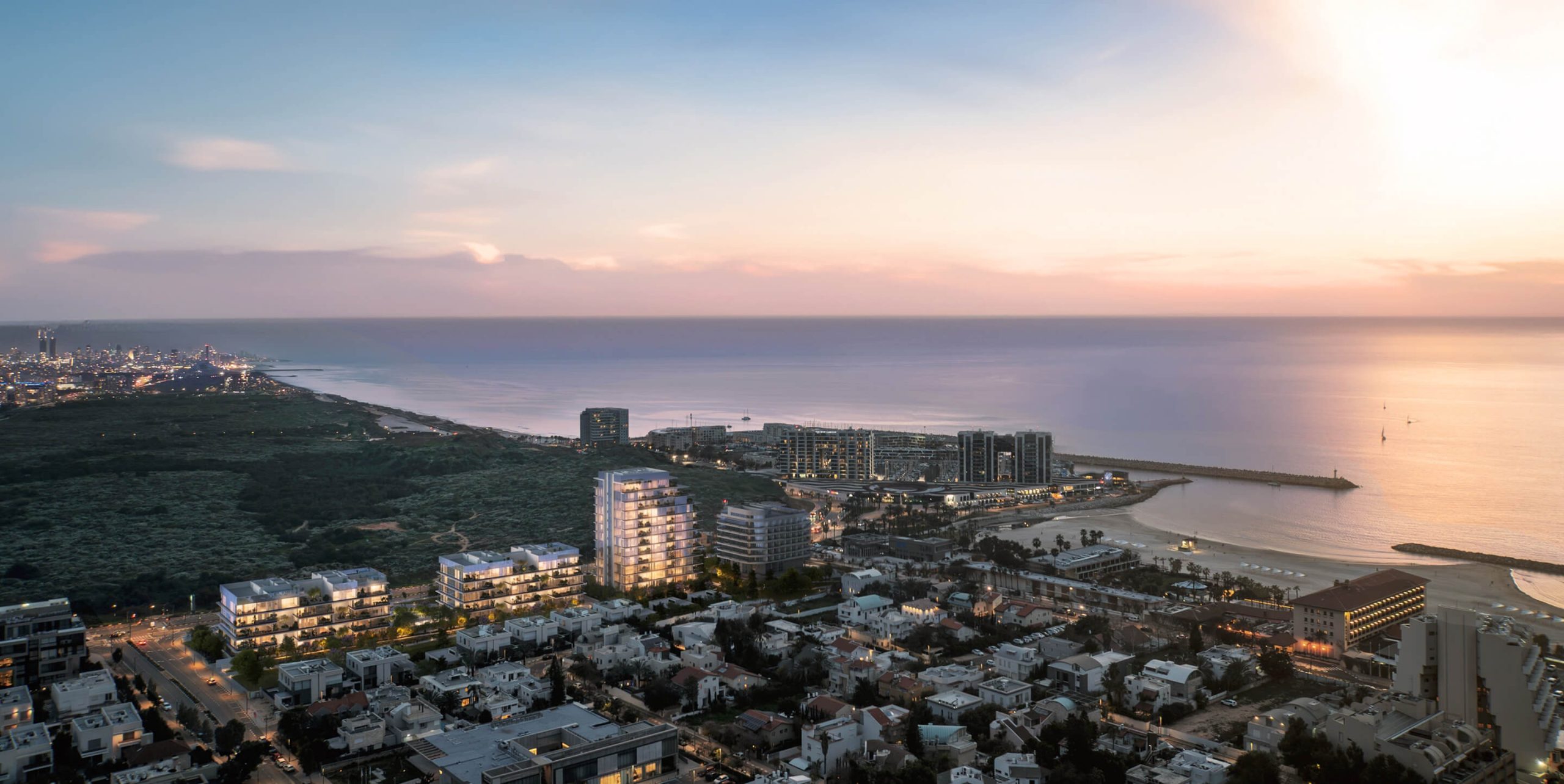 An aerial rendering of Pituach by the Sea at dusk, with the marina and the coastline behind