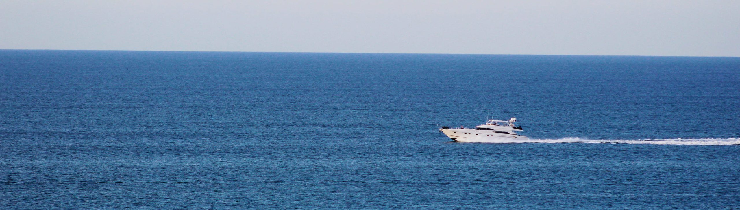 A motor yacht crossing the open sea